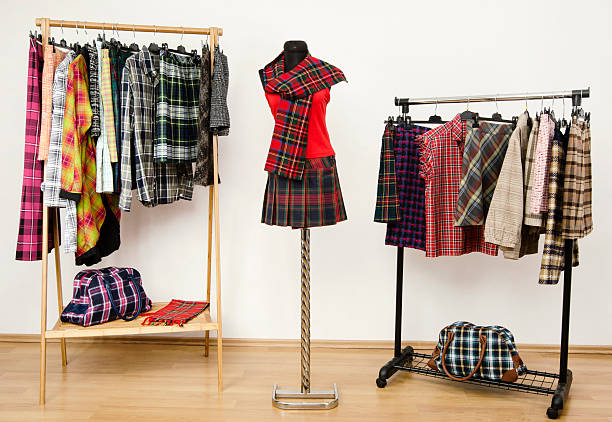 Colorful wardrobe with tartan clothes and accessories. stock photo