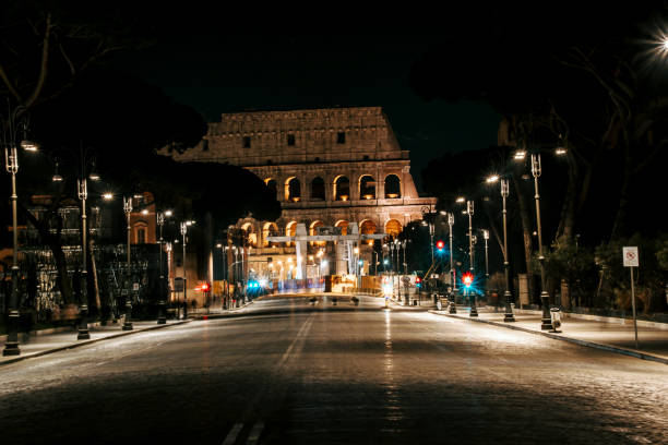 Colosseum at night in Rome, Italy Empty Roma streets due to the virus. Horizontal composition. ancient rome stock pictures, royalty-free photos & images