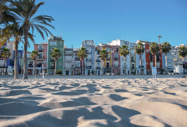 Coloured Houses (Cases do Colors) on the sandy beach in Villajoyosa in Costa Blanca, Spain Painted traditional houses in a town near Benidorm during sunset costa blanca stock pictures, royalty-free photos & images