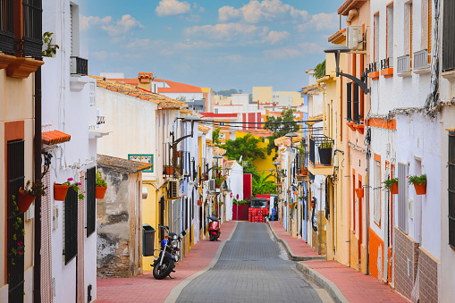 Selective focus on colourful buildings and facades on Denia street  in Alicante at Mediterranean spain