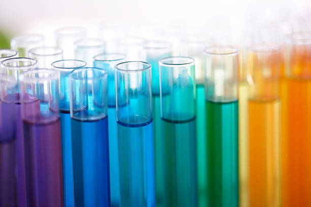 Colourful chemicals Closeup of test tubes filled with colourful liquid beaker stock pictures, royalty-free photos & images