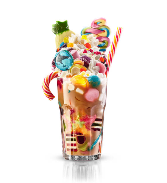 Colourful, festive cocktail with sweets, candy, jelly. Colorful array of different childs sweets and treats in cacao glass on white background. Sweet candies cociail Colourful, festive cocktail with sweets, candy, marmelade. Colorful array of different childs sweets and treats in cacao glass on white background. Sweet colored candies cociail candy jar stock pictures, royalty-free photos & images