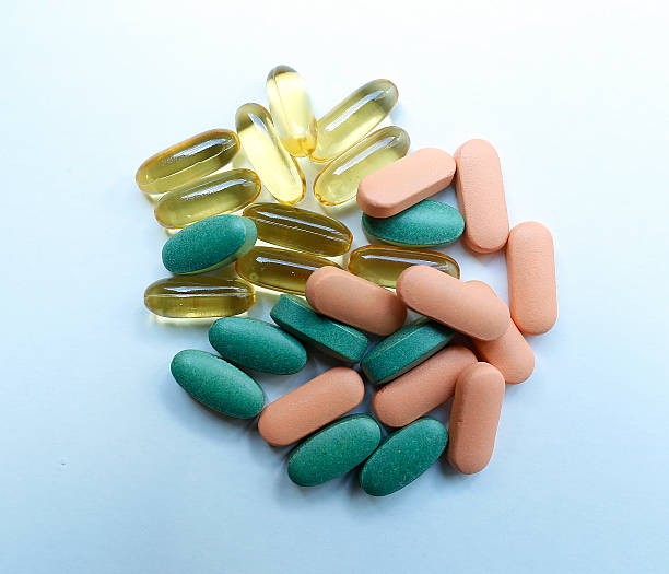 Colourful pills on a white background stock photo