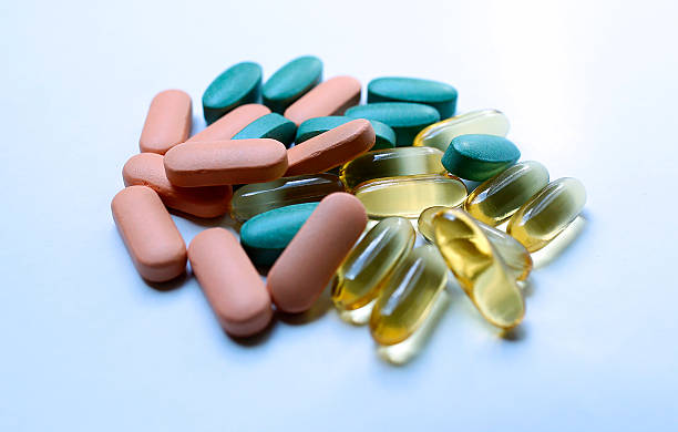 Colourful pills on a white background stock photo