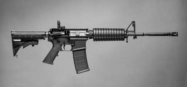 Colt AR-15 Rifle Colt AR-15 Rifle on a simple grey background. nra stock pictures, royalty-free photos & images