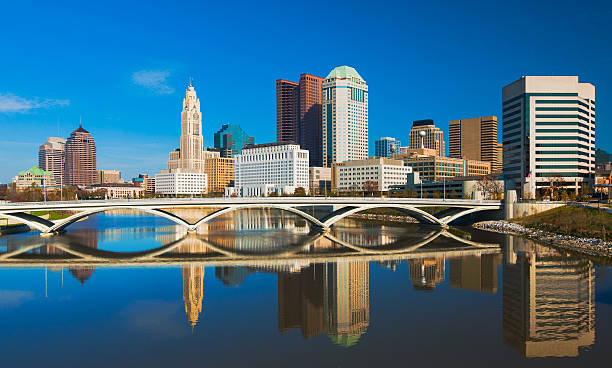 Columbus downtown skyline and bridge with mirror-like reflection stock photo