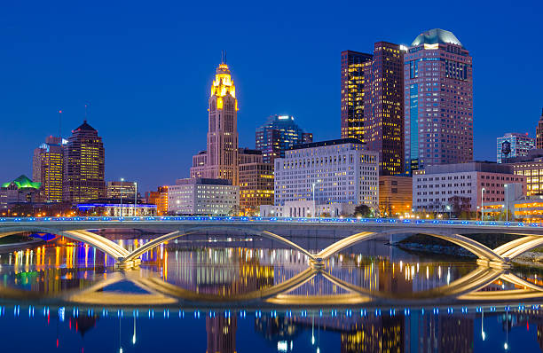 Columbus skyline at dusk / evening with river reflection stock photo