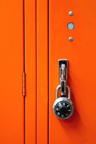 Combination metal Lock & orange Locker stock photo