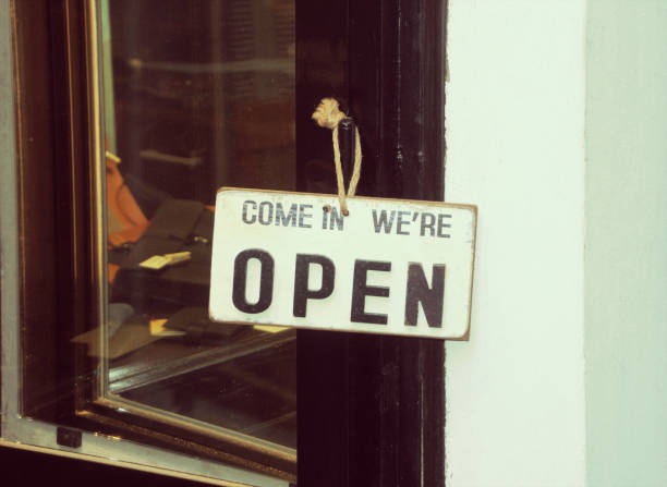 come in, we are open sign stock photo