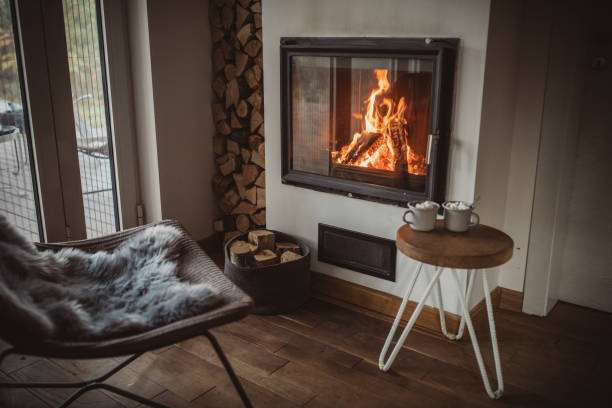 Comfort of home Cozy home interior, everything is ready for winder night, fireplace, hot chocolate firewood stock pictures, royalty-free photos & images