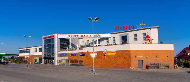 commercial complex with hotel ines and convenience shopping center in sedziszow malopolski town in podkarpacie region of poland - biedronka imagens e fotografias de stock