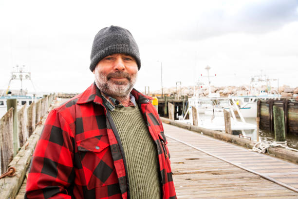 A commercial fisherman on wharf stock photo