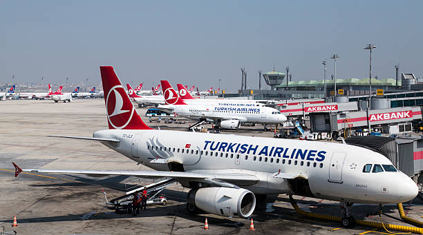 Commercial Jets Istanbul, Turkey - September 3, 2015 : Turkish Airlines planes are getting for their next flights in Istanbul Ataturk International Airport, Istanbul, Turkey.  2015 stock pictures, royalty-free photos & images
