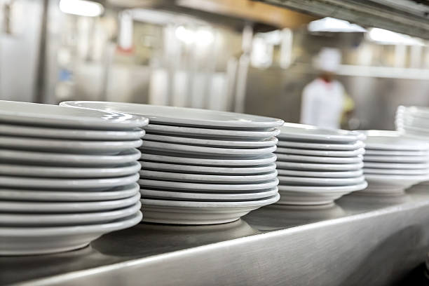 Commercial kitchen showing dishes stock photo