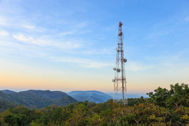Communication tower antenna on mountain at twilight stock photo