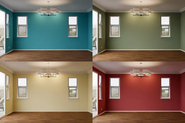 Comparison of Newly Remodeled Room of House with Wood Floors, Moulding, Ceiling Lights and Four Different Painted Wall Colors. stock photo