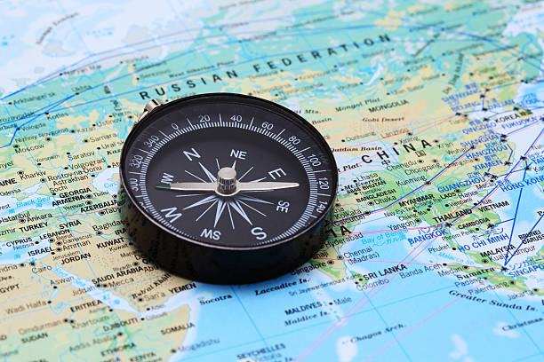 Compass and Map  central asia stock pictures, royalty-free photos & images