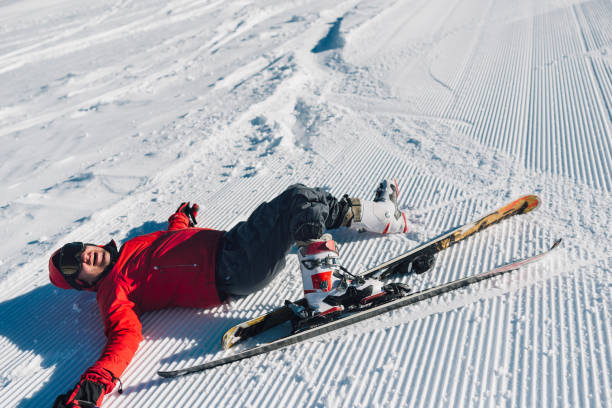 competitor fell while skiing stock photo
