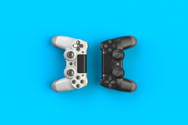 Computer game competition. Gaming concept. White and black joystick isolated on blue background, 3D rendering stock photo