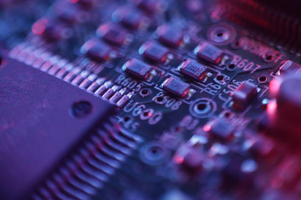Computer Microchips and Processors on Electronic circuit board.  Computer hardware technology. Abstract technology microelectronics concept background. Macro shot, shallow focus. stock photo