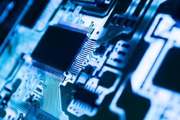 Computer Microchips and Processors on Electronic circuit board. Computer hardware technology. Abstract technology microelectronics concept background. Macro shot, shallow focus. stock photo