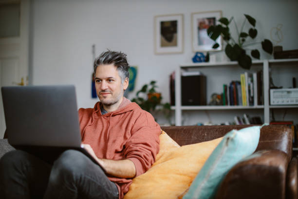 computer programmer doing work from home stock photo