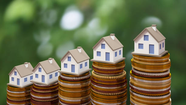 Concept by money house from coins stock photo