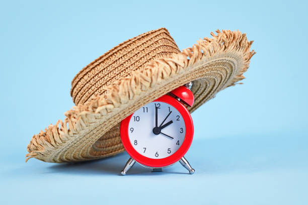 Concept for summer daylight saving time in Europe Concept for summer daylight saving time in Europe with alarm clock with straw hat daylight savings 2021 stock pictures, royalty-free photos & images