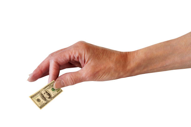Concept inflation. Tiny 100 dollar bill in human hand. stock photo