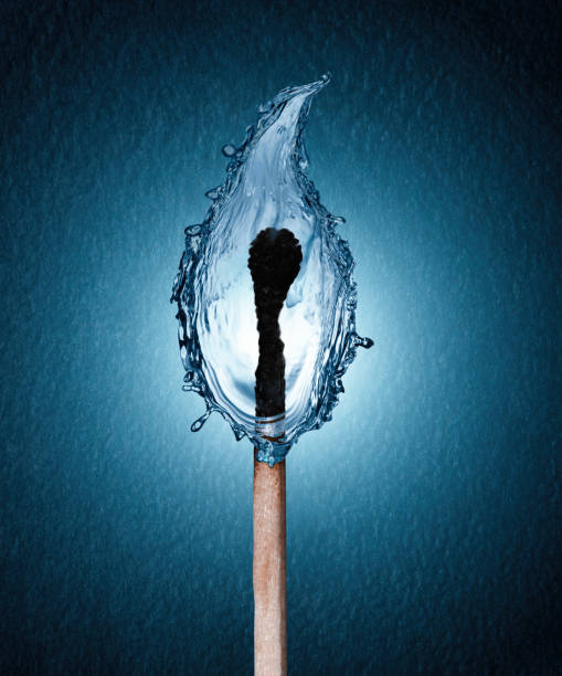 concept of a burned matchstick with a water drop flame stock photo