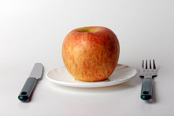 Concept of An apple a day keeps the doctor away stock photo