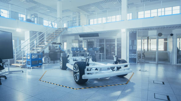 concept of authentic electric car platform chassis prototype standing in high tech industrial machinery design laboratory. hybrid frame include tires, suspension, engine and battery. - car charger imagens e fotografias de stock