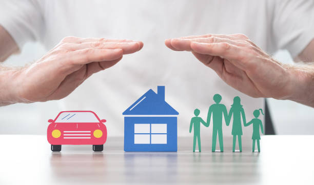 Concept of life, home and auto insurance Family, house and car protected by hands - Concept of life, home and auto insurance insurance stock pictures, royalty-free photos & images