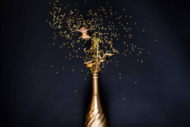 concept of opening an expensive golden champagne stock photo