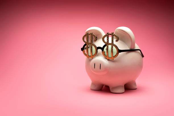 Concept Photo of a White Large Piggy Bank on Pink Background stock photo