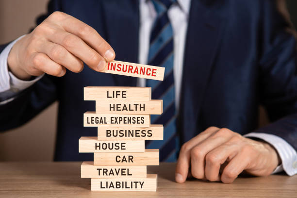 INSURANCE concept. Stack of wooden blocks with words: life, health, legal expenses, business, house, car, travel, liability. INSURANCE concept. Stack of wooden blocks with words: life, health, legal expenses, business, house, car, travel, liability. insurance stock pictures, royalty-free photos & images
