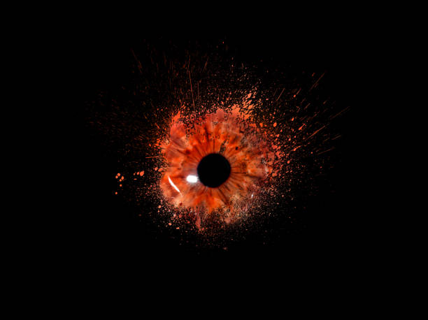 Conceptual creative photo of a female eye close-up in the form of splashes, explosion and dripping paint isolated on a black background. Female eye close-up with spray paint around. stock photo