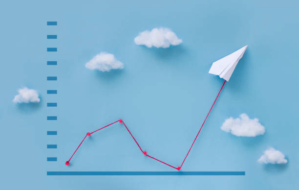 Conceptual paper plane pulling business finance growth chart still life image. Conceptual origami paper plane pulling business finance growth chart line flying upwards on blue sky background. create an account stock pictures, royalty-free photos & images