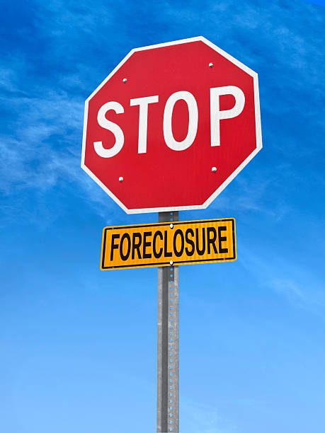 conceptual stop sign with word foreclosure conceptual stop sign with word foreclosure over blue sky foreclosure stock pictures, royalty-free photos & images