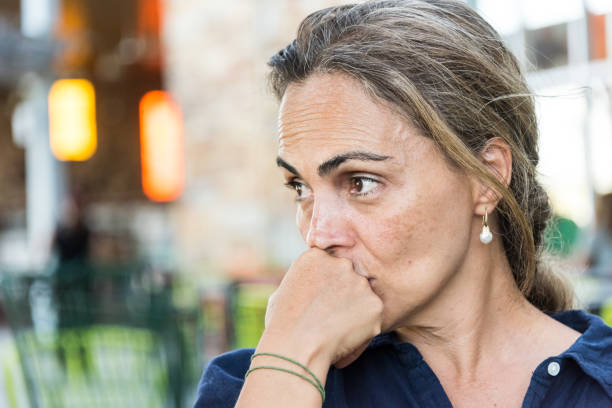 Concerned serious mature woman Concerned serious mature hispanic or middle eastern woman introspection stock pictures, royalty-free photos & images