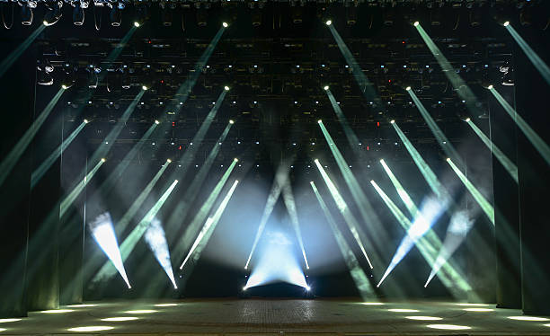 Concert stage Illuminated empty concert stage with smoke and rays of light acting performance stock pictures, royalty-free photos & images