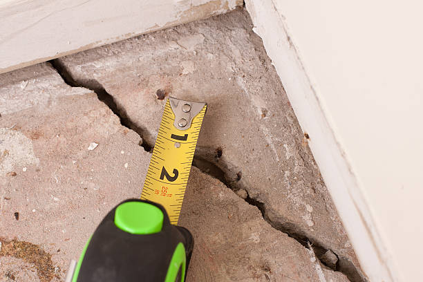 Concrete Crack in Foundation large deep crack in concrete foundation of house crevice stock pictures, royalty-free photos & images