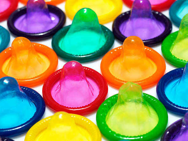 Condoms in rainbow colors stock photo