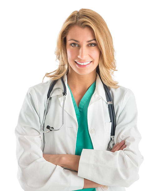 Confident Female Doctor Standing Arms Crossed stock photo