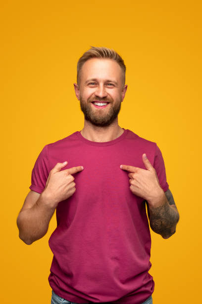 Confident guy pointing at himself stock photo