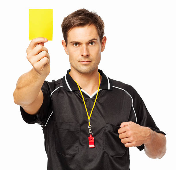 confident soccer referee showing yellow card - gele kaart stockfoto's en -beelden