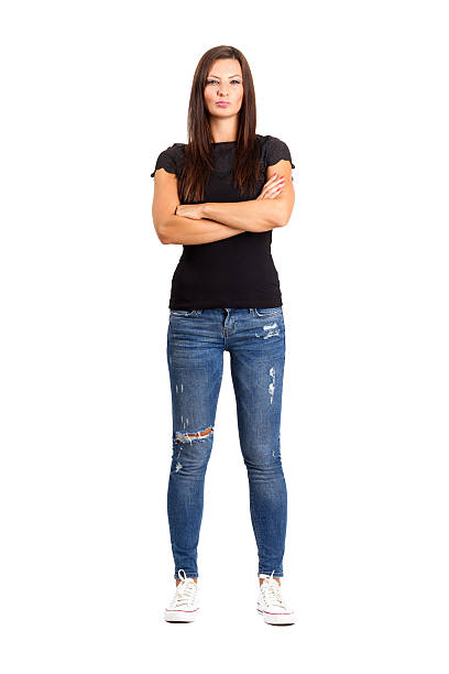 Confident unhappy woman with crossed or folded arms. Confident unhappy woman with crossed or folded arms. Full body length isolated over white. furious photos stock pictures, royalty-free photos & images
