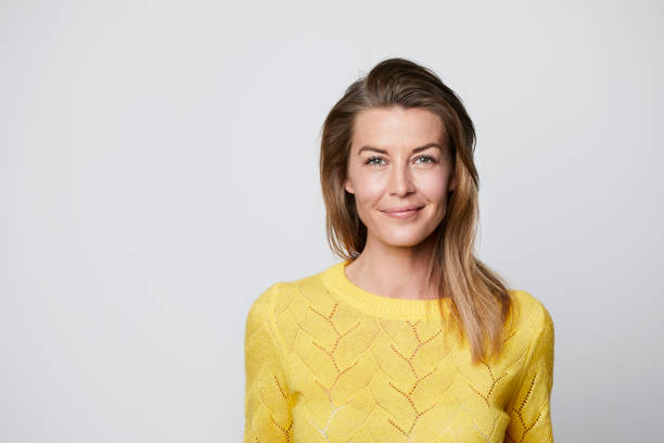 Confident woman Confident woman in yellow top, portrait scandinavia photos stock pictures, royalty-free photos & images