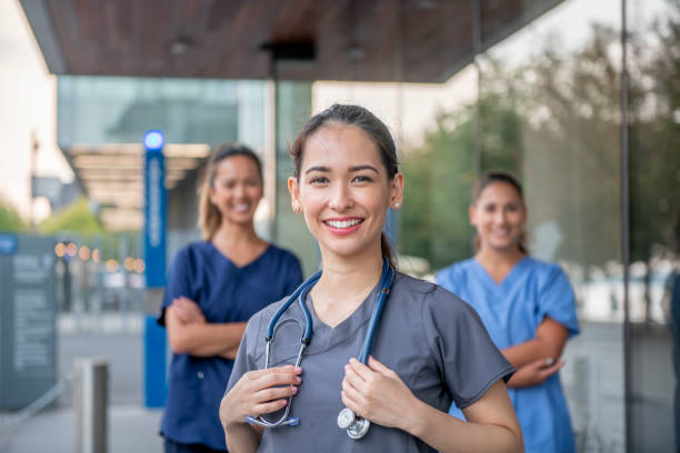 Confident young mixed race female doctor stock photo