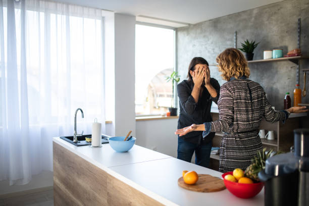 Conflict between man and woman Young married couple having argument in the kitchen in the morning arguing photos stock pictures, royalty-free photos & images